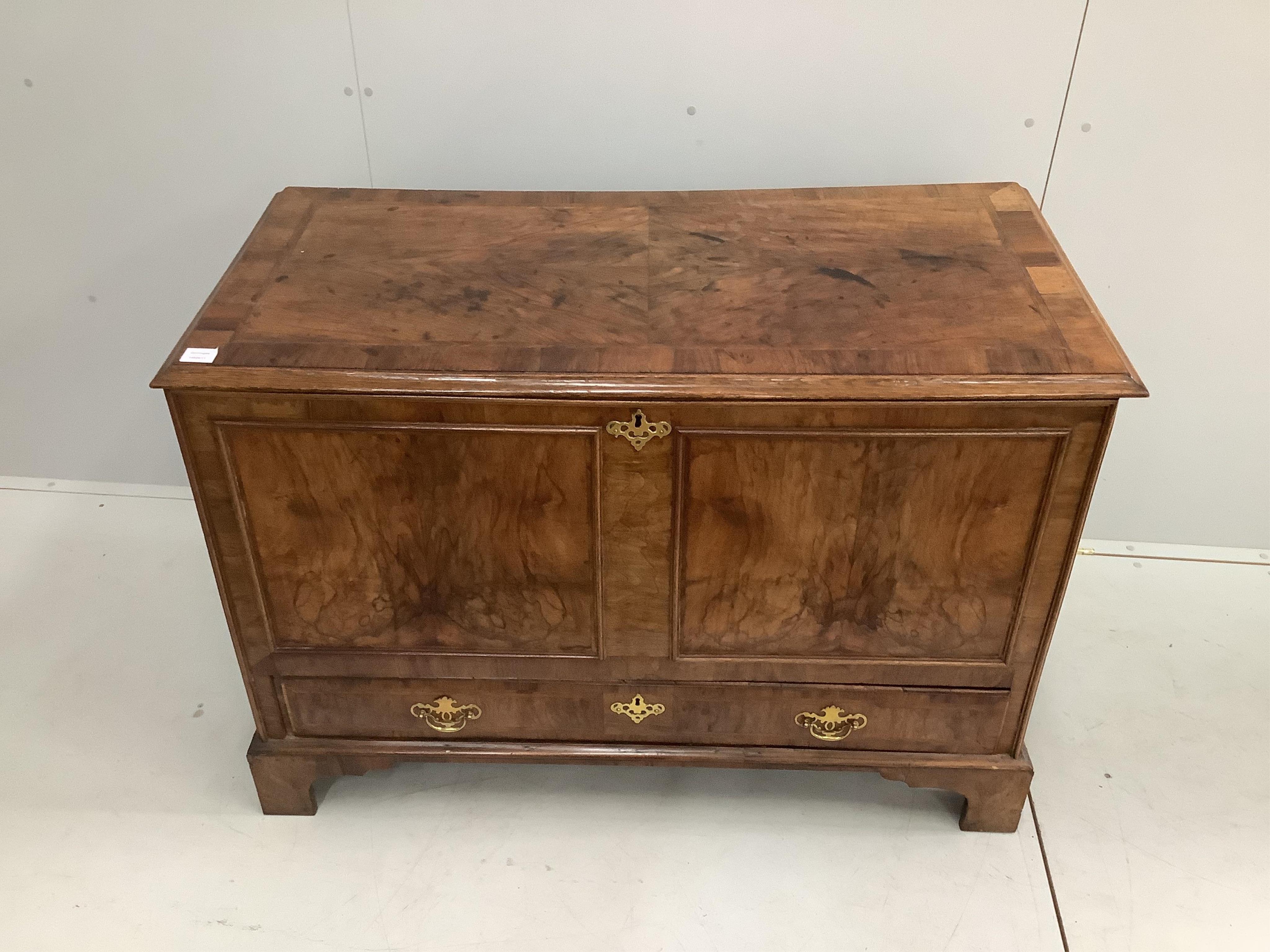 A George I / II feather-banded walnut and oak mule chest, width 120cm, depth 57cm, height 84cm. Condition - fair